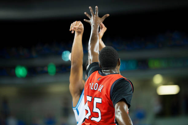 istock Basketball players playing on court 1256281827
