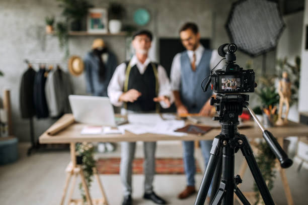 istock Senior and young professional cloth designers teaching online 1256282261