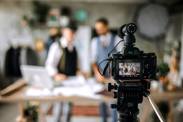 istock Senior and young professional cloth designers teaching online 1256282307