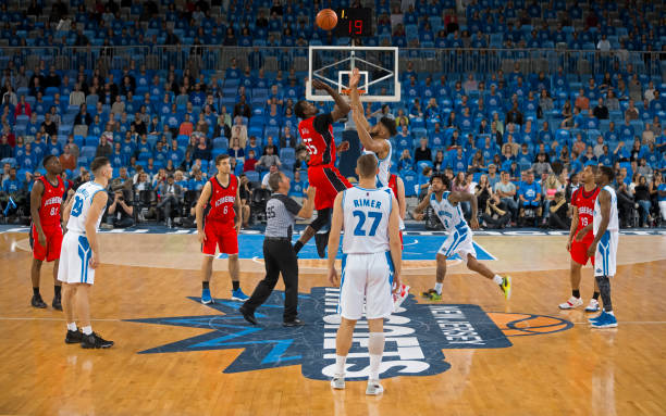 istock Basketball players chasing for ball 1256283385