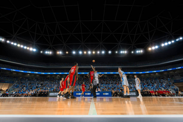 istock Basketball players chasing for ball 1256283394