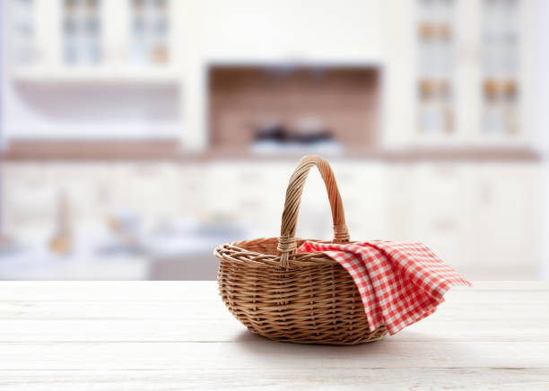 istock Empty basket with red napkin picnic on table place. Kitchen interior. 1256283404