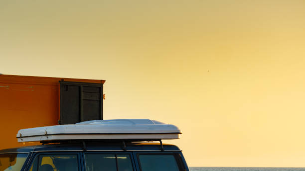 istock Camper van with closed tent on roof top 1256289848