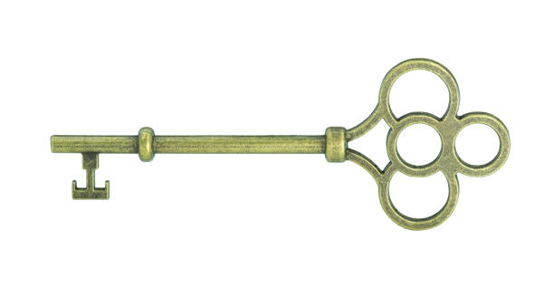 istock Vintage antique golden key isolated on white background with clipping path. 1256290464