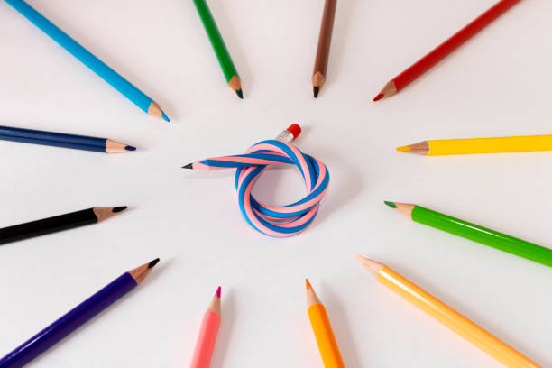 istock Flexible pencil and a set of colored pencils on a light background. Selective focus. 1256292216