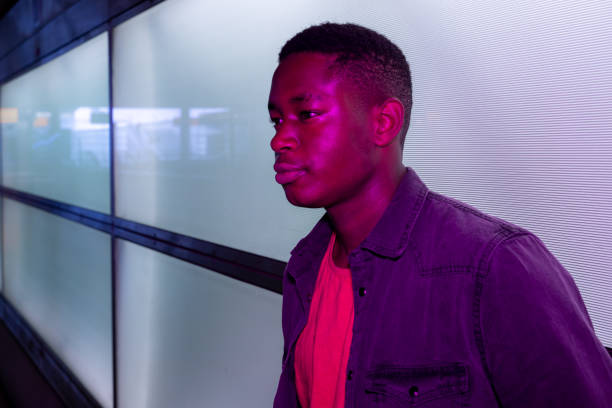 istock Portrait Of Young Man Looking Away 1256295730