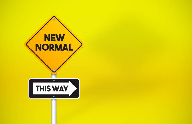 istock New Normal Directional Road Sign On Yellow Background 1256297818