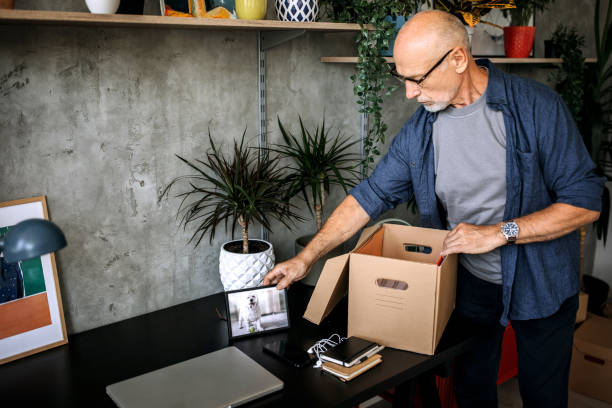 istock Senior man making rearrangement for his home office 1256297864