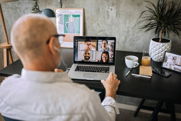 istock Senior man on a video conference call in his home office 1256298053