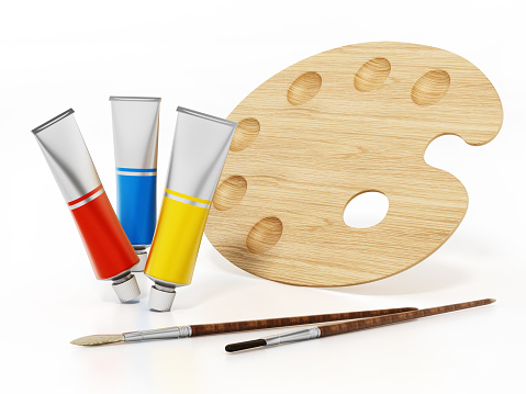 Pallette, oil paint tubes and paintbrushes isolated on white.
