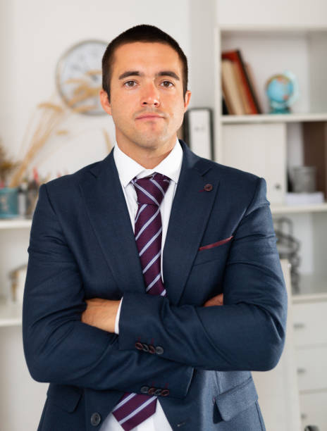 istock Portrait of smiling businessman who is at his work place 1256302425