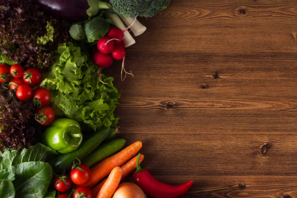 istock Fresh Vegetables on a Wooden Background 1256304306