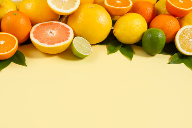 istock Citrus Fruits on Yellow Background 1256304353