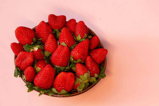 Strawberries in ceramic bowl. stock photo