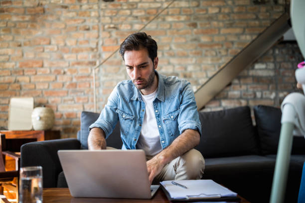 istock Young man working at home due to pandemic isolation 1256312622