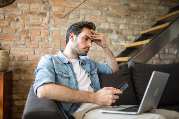 istock Young man working at home due to pandemic isolation 1256312635