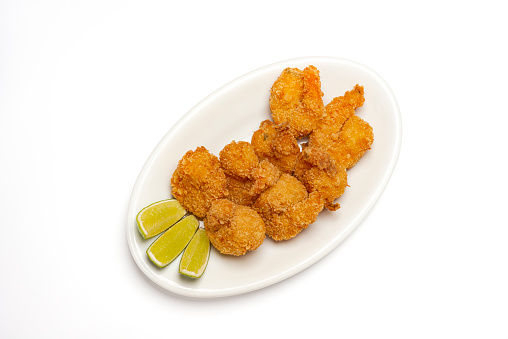 Image of fried shrimp with slices of lime