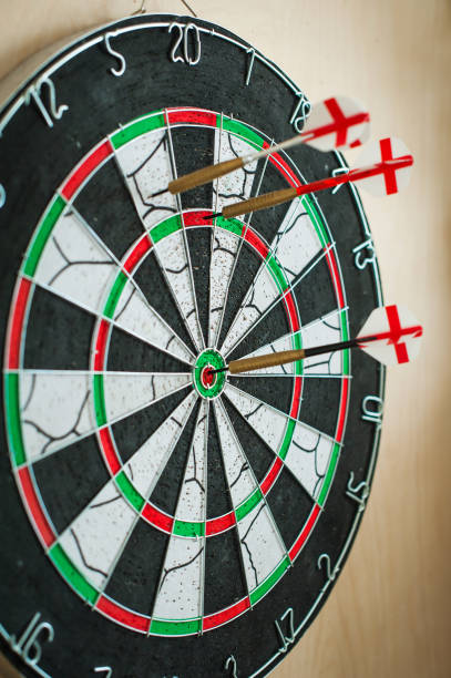 istock Success hitting target aim goal achievement concept background - three darts in bull's eye close up. red three darts arrows 1256313246