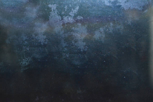 istock Grunge on a dark blue background with scratches and lint on the surface 1256313485