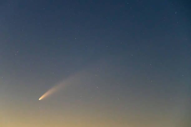 istock Neowise Comet and its long dust tail after dusk 1256314317