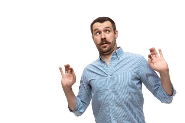 istock Young caucasian man with funny, unusual popular emotions and gestures isolated on white studio background 1256314578