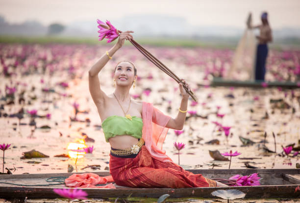 istock Woman With Pink Flower 1256314770