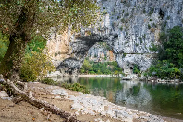 iew of the natural rock arch in france, the famous spot for the canoe trip