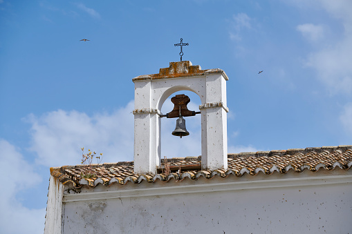 Detail of the bell tower on tje top of a house of Montefrio, Granada