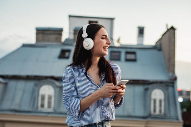 istock Young woman enjoying on the rooftop 1256317191