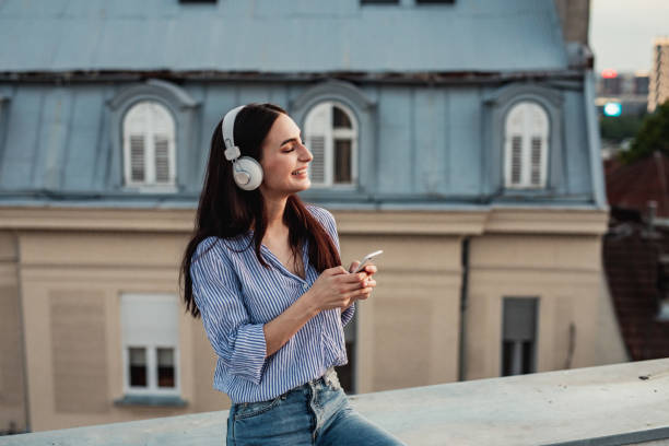 istock Young woman enjoying on the rooftop 1256317239
