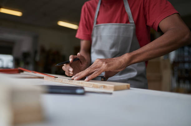istock Asian male carpenter working at his studio workshop 1256317341