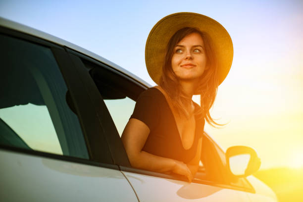 istock Young woman enjoying a road trip 1256317532