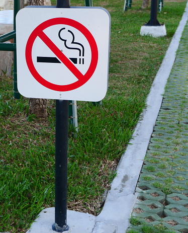 Close-up No smoking sign in the public park.