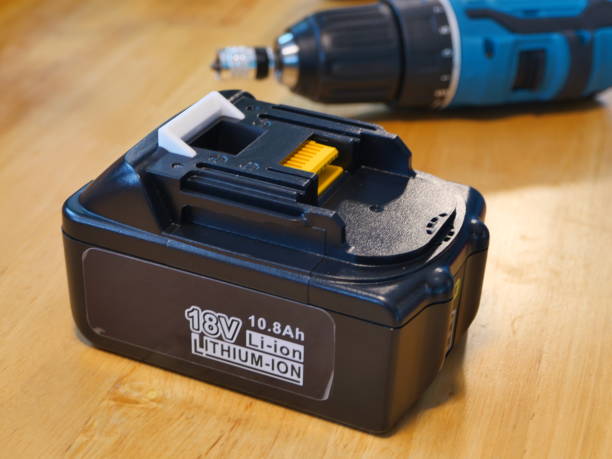 istock Battery for drill screwdriver and drill screwdriver . 1256321159