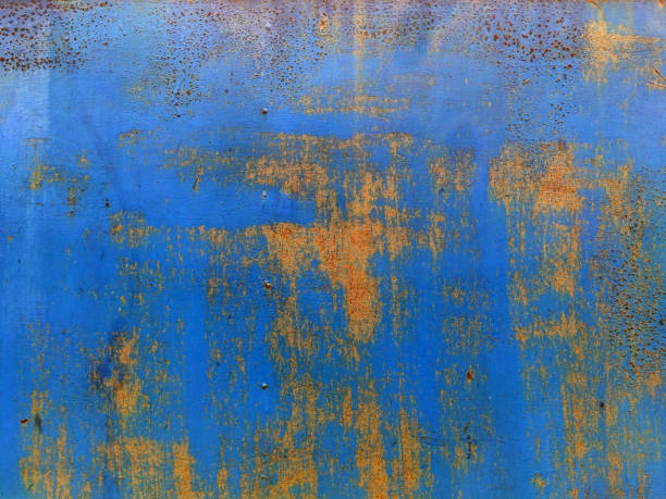 istock Rusty metal background with streaks of rust. Corroded metal background. Rust stains. Rystycorrosion. 1256322349