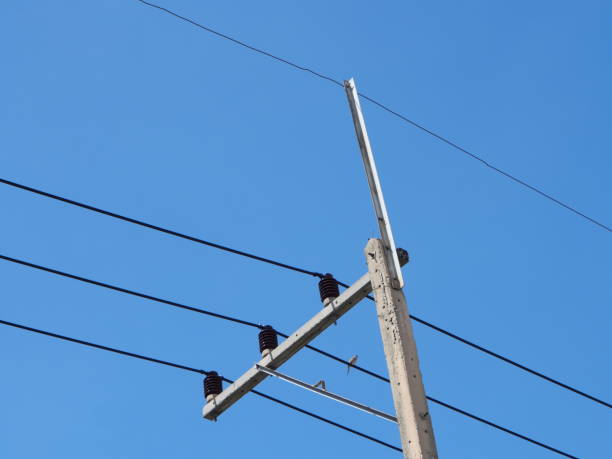 istock Street pole with wires on blue sky 1256322946
