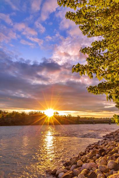 istock Bright Summer Sunrise Sky Over The Bow River 1256323688