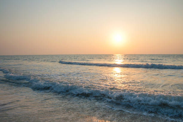 istock Scenic View on Beach Against Sky During Sunrise 1256328964