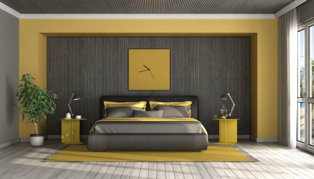 istock Black and yellow modern master bedroom 1256329164