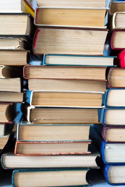 istock A stack of books and pencils on a desk in elementary school. A stack of colorful books. Education background. Business education concept. Copy space for text. 1256330212
