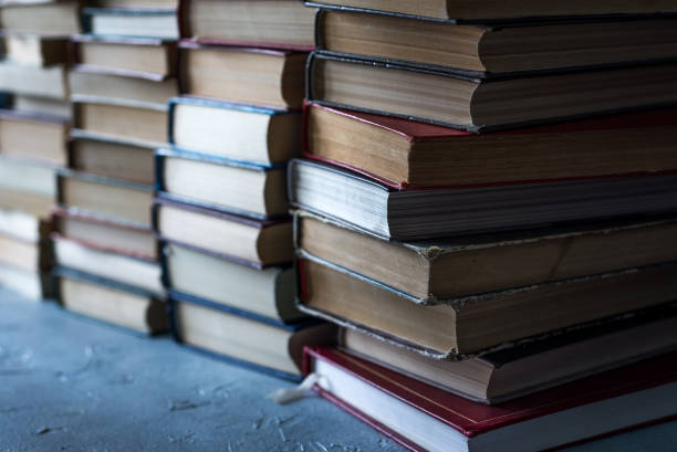 istock A stack of books and pencils on a desk in elementary school. A stack of colorful books. Education background. Business education concept. Copy space for text. 1256330259