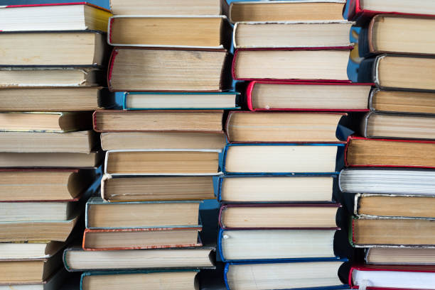 istock A stack of books and pencils on a desk in elementary school. A stack of colorful books. Education background. Business education concept. Copy space for text. 1256330275