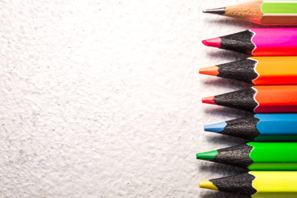 istock A stack of books and pencils on a desk in elementary school. A stack of colorful books. Education background. Business education concept. Copy space for text. 1256330370