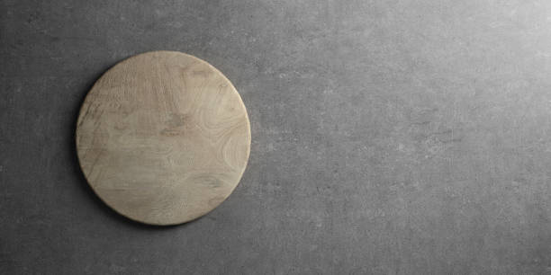 istock rustic wooden cutting board on table top as template 1256333219