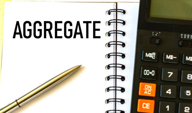 istock AGGREGATE word in a notebook with a pen and calculator 1256333460