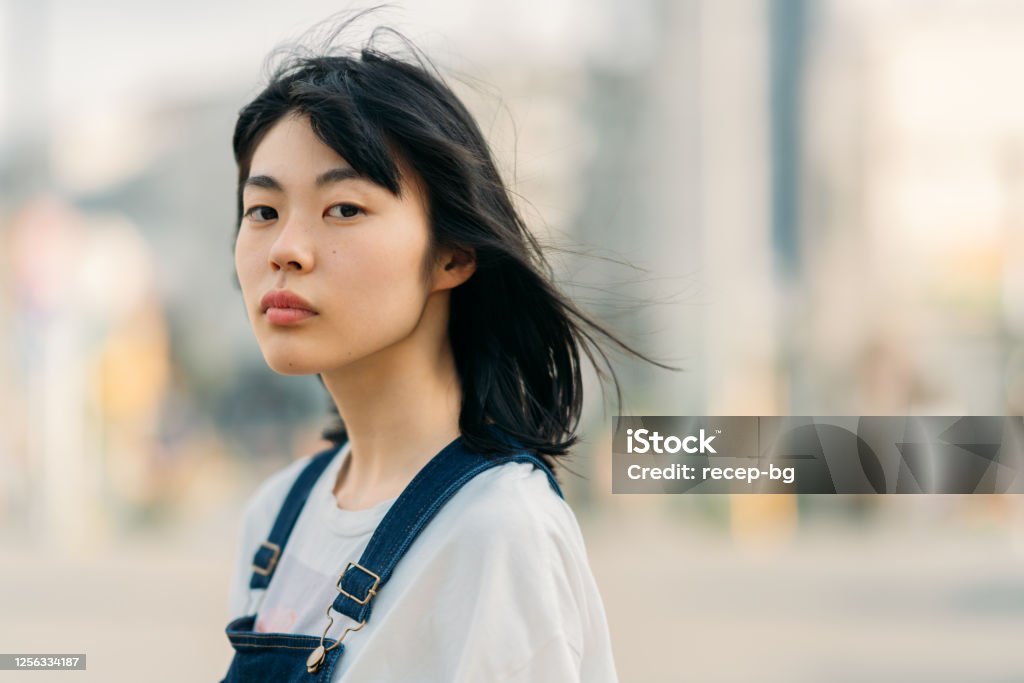 Portrait of young woman on windy day A portrait of a young woman on a windy day. Women Stock Photo