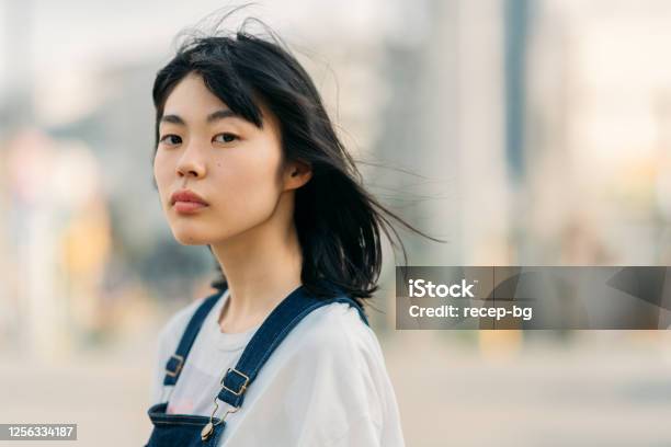 Portrait Of Young Woman On Windy Day Stock Photo - Download Image Now - Women, Portrait, One Woman Only