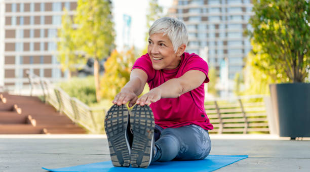 istock Mature woman exercising 1256335438