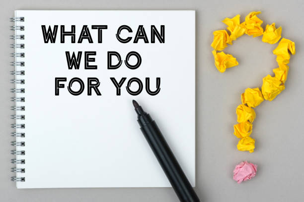 istock Hand with marker writing: What Can We Do For You. 1256337569
