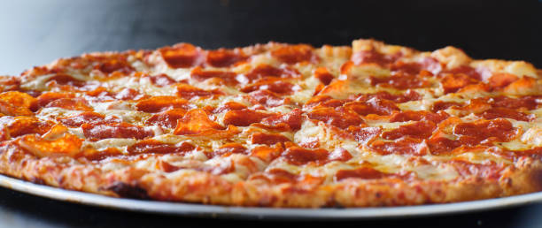 istock large american style pepperoni and cheese pizza 1256339164
